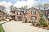Brick curb appeal with cedar shutters and copper flashing no image